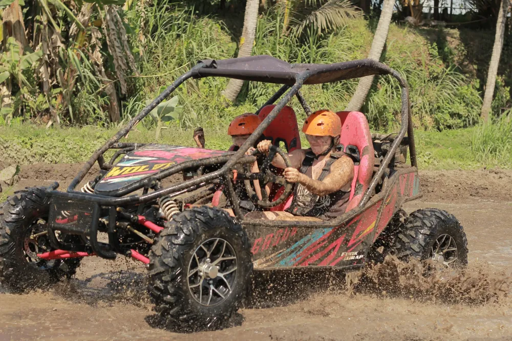Buggy making a wide muddy splash