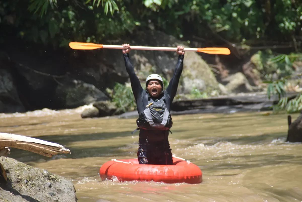 Guest floating through a green river corridor